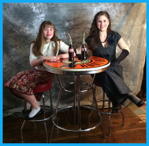 We attended my friend Andrea's birthday party last weekend, a festive 1940's-themed costume party.  Andrea found this vintage A&W root beer table on the tag sale site for $20! She fixed it up and provided props for party guests to take fun photos with. 
