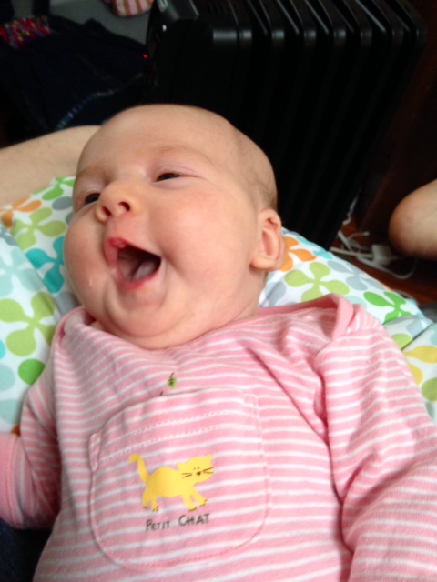 Now that is one happy milk-faced baby!