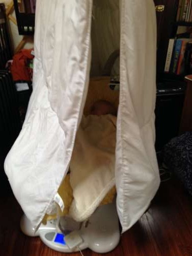 This is  a silly picture of Ava napping under a mostly dry comforter drying on the line.  Her first fort!