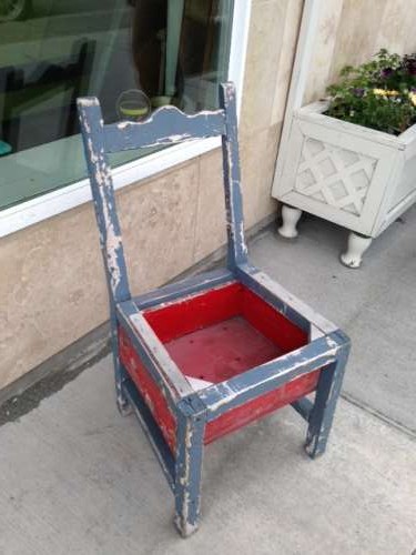 Old Chair turned flower box!  faintly patriotic and lovely.