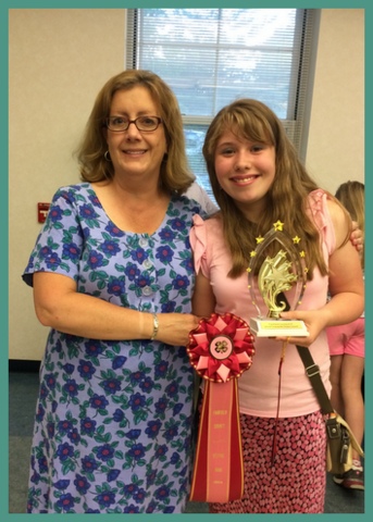 My daughter and her club's leader, Alison Rogers, at Recognition Night, when all 4-h members in the county are recognized for their hard work during the year.