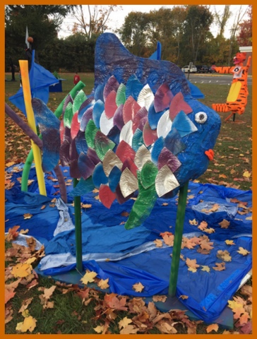 A rainbow fish with foil 'scales' and a tarp for water.