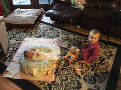 Sisters!  Ava loves to serenade Opal with her original music.
