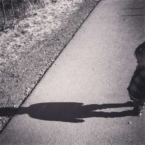 A toddler and her shadow.  I caught her giving it a smooch the other day! Precious.