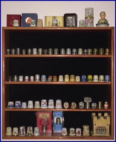 The little velvet-lined shelf was in disrepair that I found for $2.00. After fixing and staining it, I found it perfect to hold thimbles!