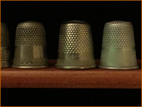 Fun to find at flea markets, thimbles give clues to their age. Rounded tops are older, while flat-topped one are more "modern"