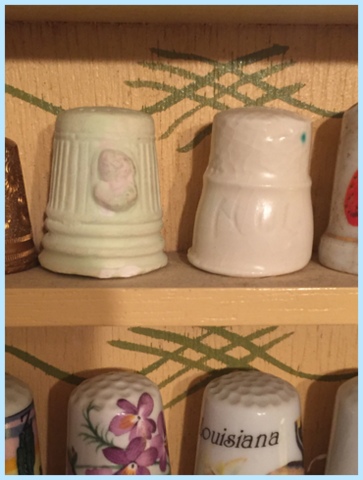 I made these two that my mom kept on her thimble rack when I was around seven in a ceramics class. Raw art there!