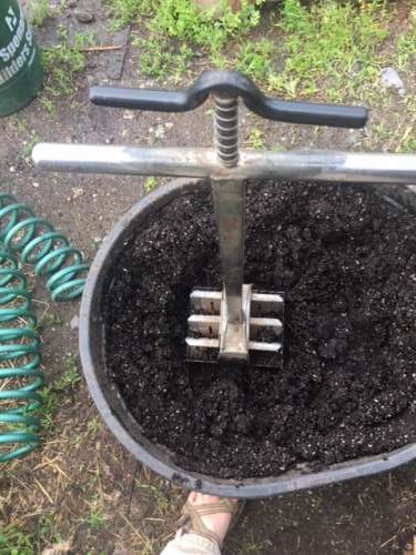 The Soil Blocking process--First, fill soil blocker with very damp (almost dripping) potting soil.  Press into the blocks firmly.