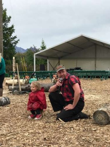 High winds mean low crowds at the state fair.  Because of this, Ava won a cute little chair at the lumberjack show!