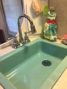 My husband installed a shiny new faucet. It looks vintage-y but has a cool factor: a blue LED light comes on when the water runs!