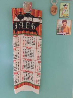 A mint linen tea towel calendar found in an antique store in the Adirondacks now graces the fridge.