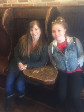 My daughter and I sitting by the historical wall. 