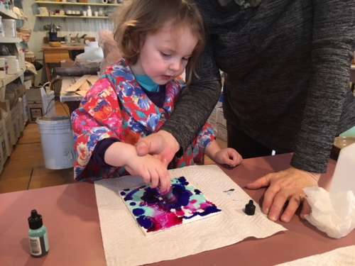 Ava experimenting with alcohol inks.  This is a quick, affordable and pretty easy project to bring some creativity and color to frigid days.