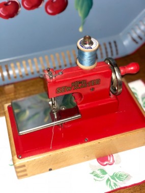 This sweet little machine (I named after MaryJane) sits in my kitchen atop one of a set of cherry themed napkins from the 40’s, tying into the theme of my kitchen. 