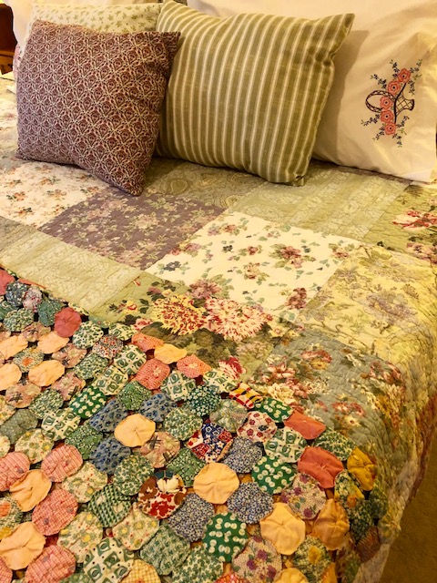 My bed is a mix of new and old. The yo-yo throw and pillow cases are vintage, the quilt is new, mass-produced, and the throw pillows are made by me from vintage-style fabric. Layering makes a bed cozy and inviting. 