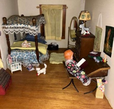 The porcelain kitten  in the little girl’s roomwas mine as a child, and part of my original dollhouse.