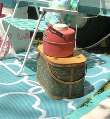 My large vintage picnic basket is made by Hawkeye. Redmond is another brand with similar baskets. Inside the camper,  it makes great storage, while outside it looks cute and can serve as an outdoor “end table”. 