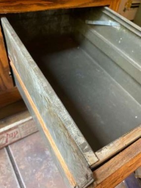Built-in  bread boxes in the form of tin-lined drawers were a staple of Hoosier-type kitchen cabinets. 
