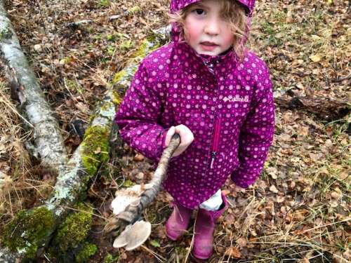 Nature walks yield fun finds! Ava with her portable fungus stick, a gift for me!