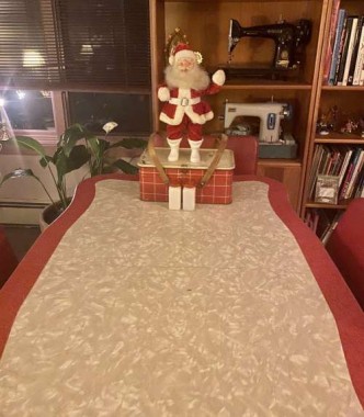 My aniversary Santa sits in the playroom (on the vintage 50’s table I got for $10. It was covered in rust and paint and took a lot of elbow grease to get it gleaming, but we use it all the time for casual eating, crafts, and Zoom meetings. 