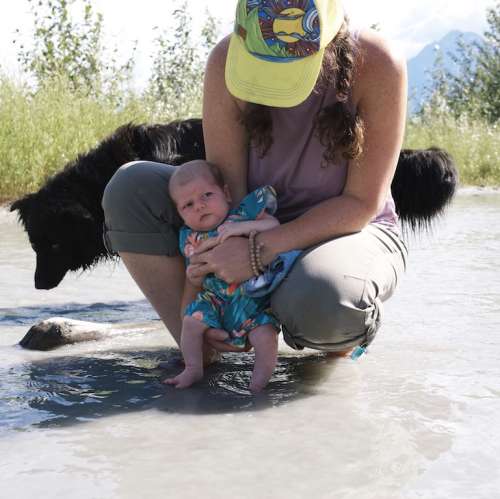 Nova gets "baptized" in the glacial waters of the Matanuska River