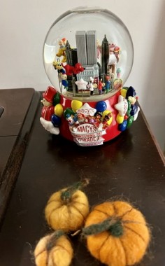 A Thanksgiving parade snow globe my best friend gifted me once comes out after Halloween