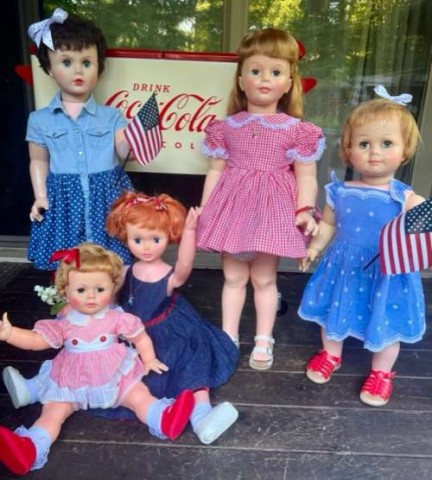 Part of the fun of this hobby is “staging” dolls. This was a fun photo for the 4th of July. The doll in the far left corner is an example of another brand’s companion doll. 