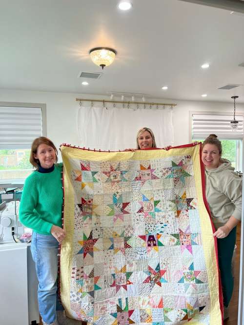 The girls with the almost finished quilt!  