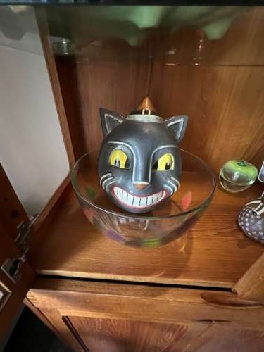 This vintage looking mask is a gift from my daughter…it adds retro charm inside the curio cabinet.
