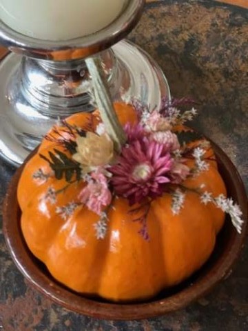 My friend Robin from Pennsylvania is known for her beautiful pumpkins with dried flowers from her farm. They stay fresh through to the holidays. 