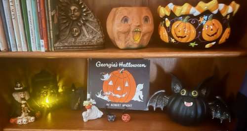My bookshelves are a mix of retro, vintage, and reproduction Halloween. 